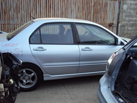 2004 MITSUBISHI LANCER 4 DOOR SEDAN OZ MODEL 2.0L MT FWD COLOR SILVER 143654